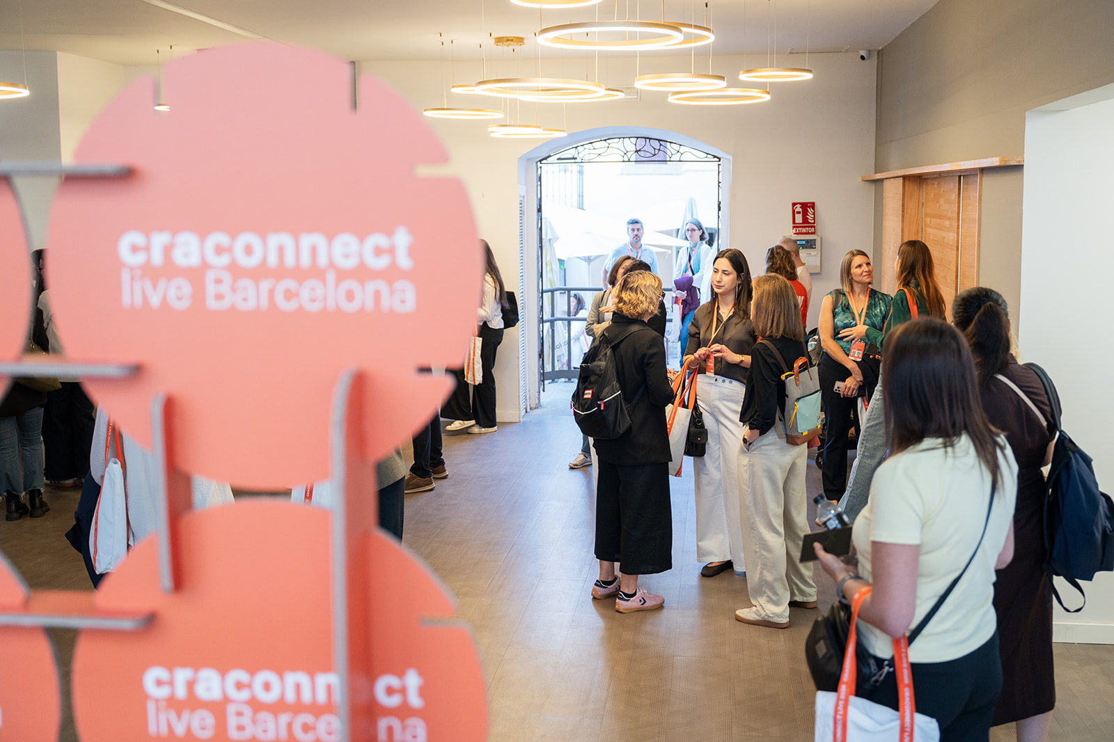 Attendees at the photo backdrop